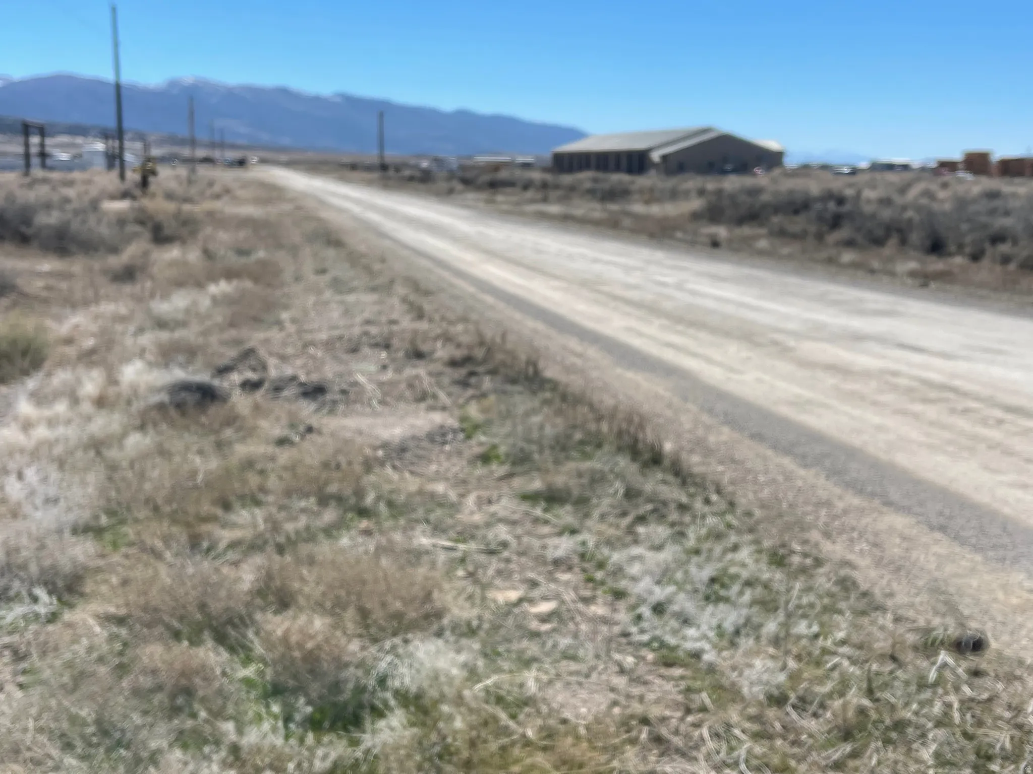 View of road with a mountain view and a view of countryside
