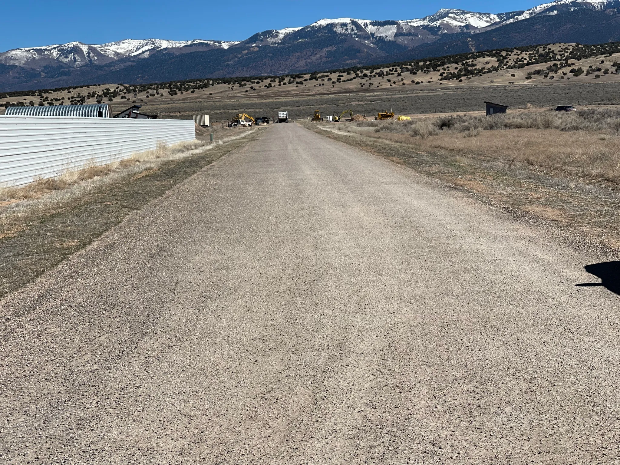 View of mountain background featuring rural landscape