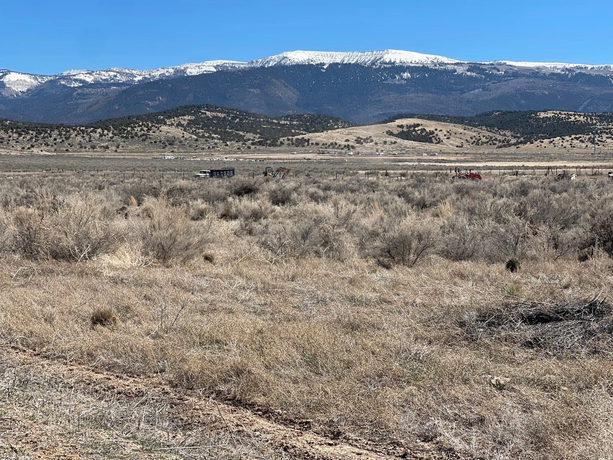 View of mountain backdrop featuring rural landscape
