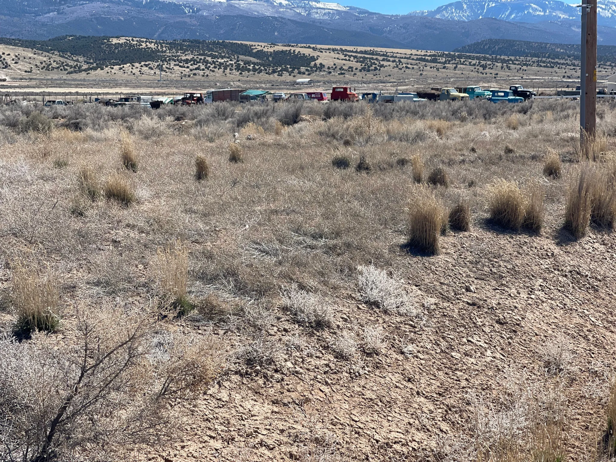 View of mountain backdrop with rural landscape