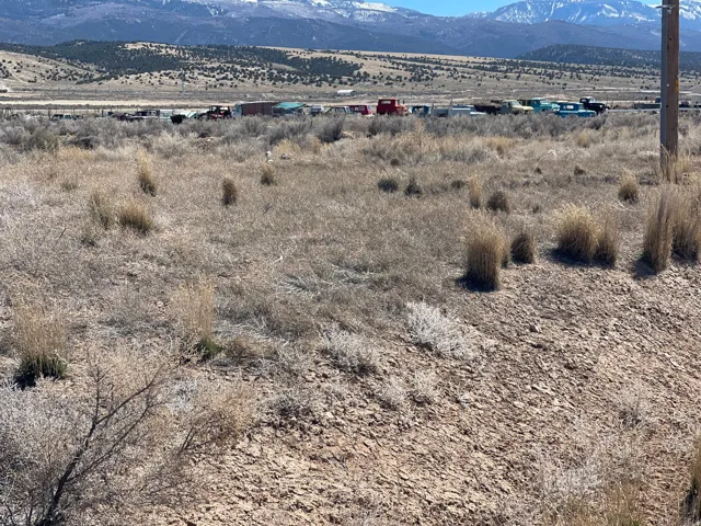 View of mountain backdrop with rural landscape
