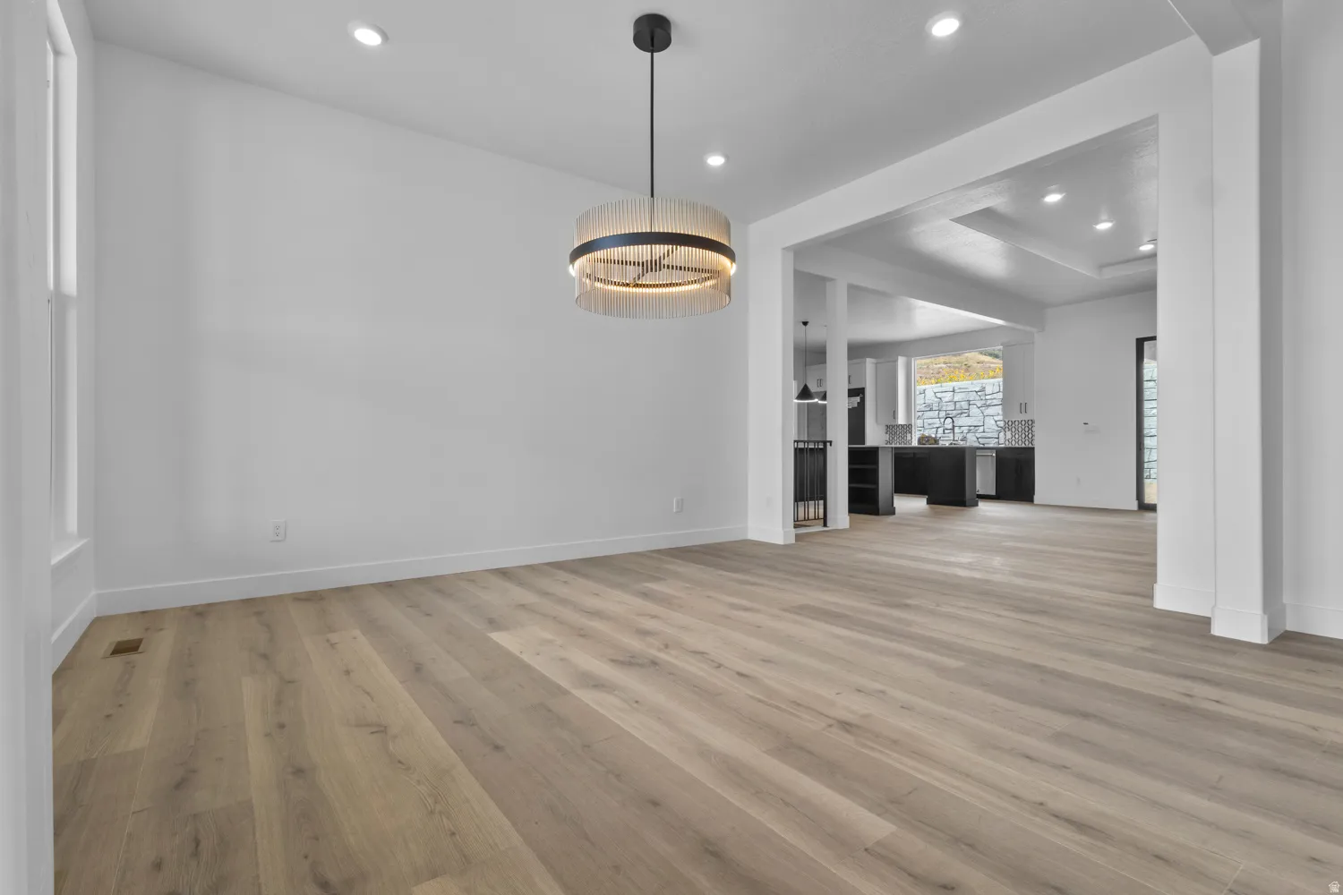 Unfurnished dining area featuring recessed lighting and light wood-style floors