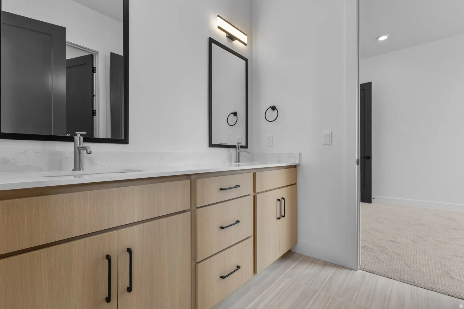 Full bath featuring double vanity and recessed lighting