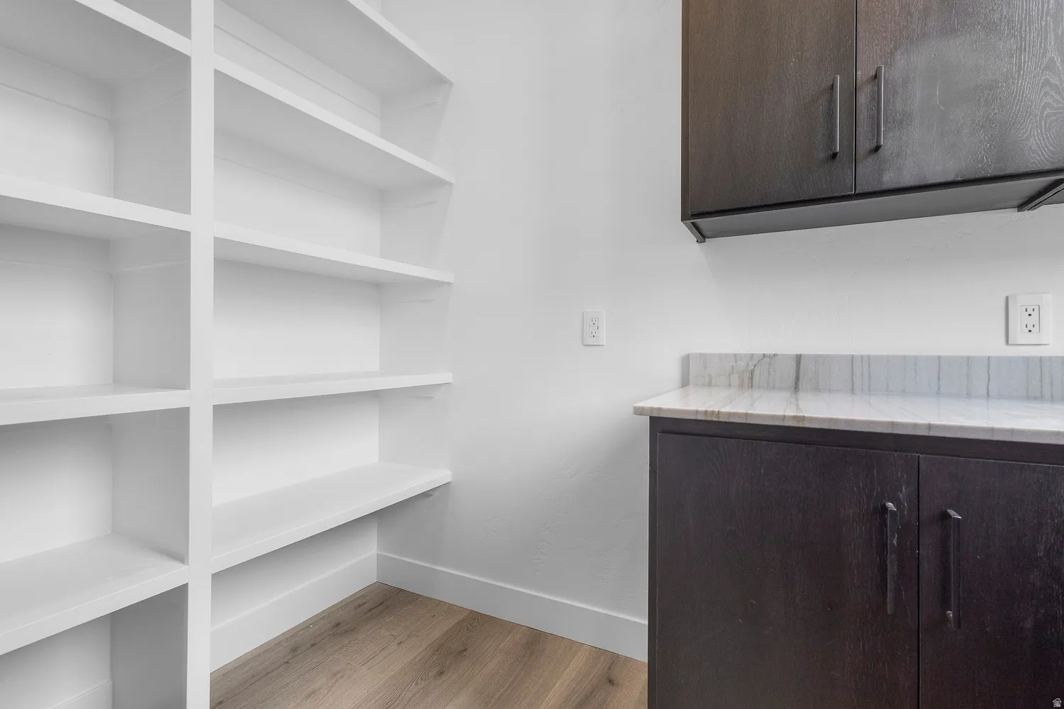 Detailed view of wood finished floors and baseboards