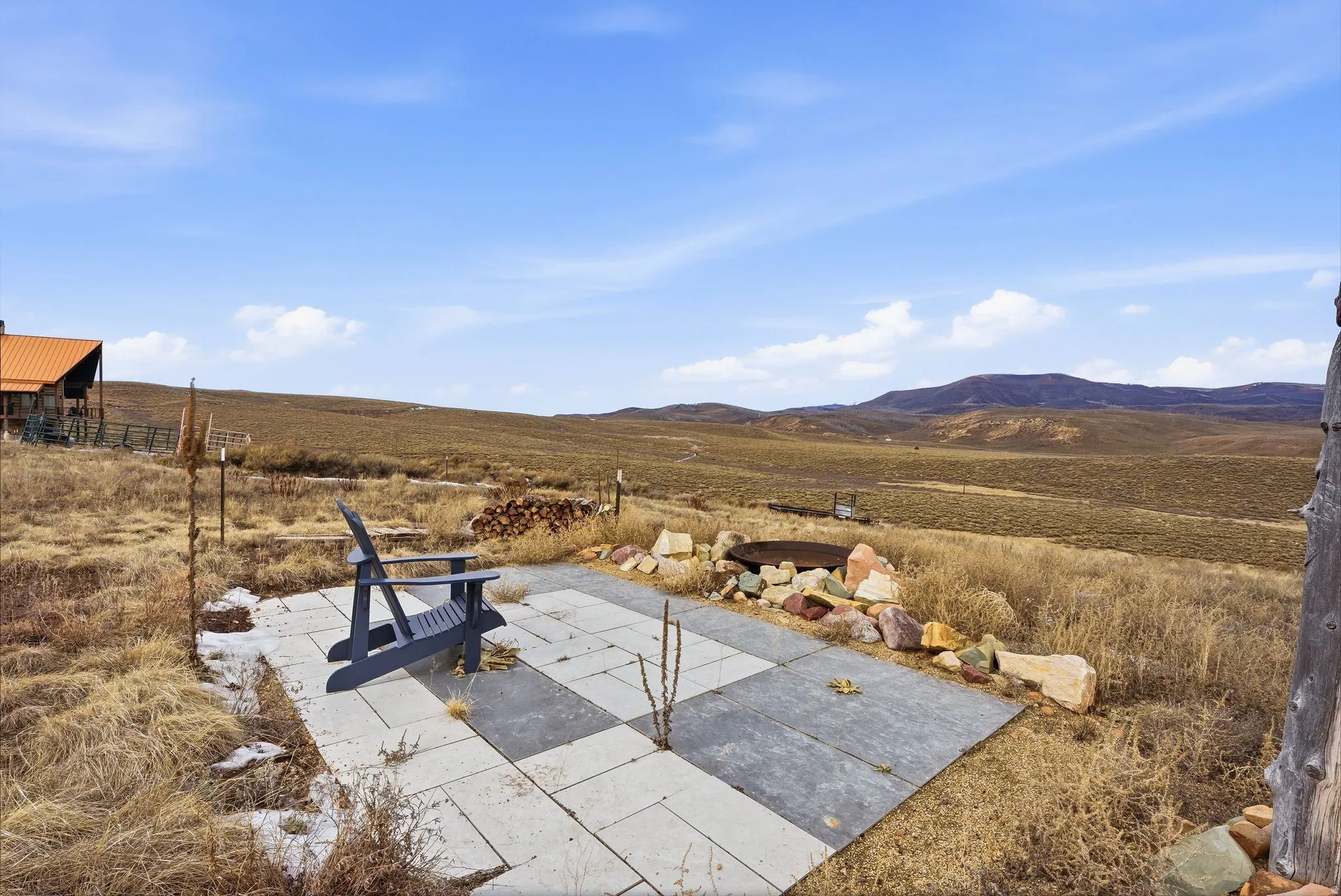 Aerial view of sparsely populated area with a mountainous background