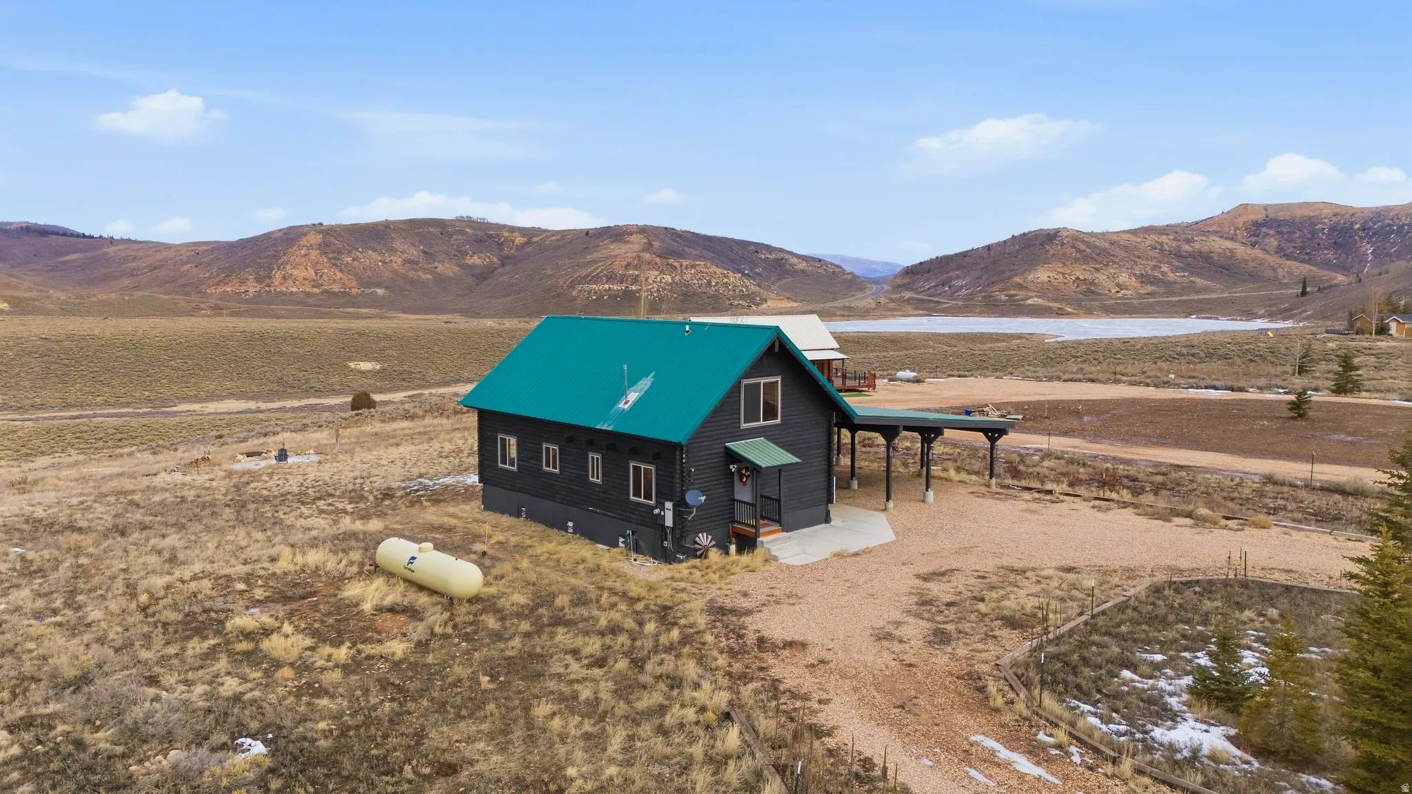 View of front facade with a mountain view and a metal roof