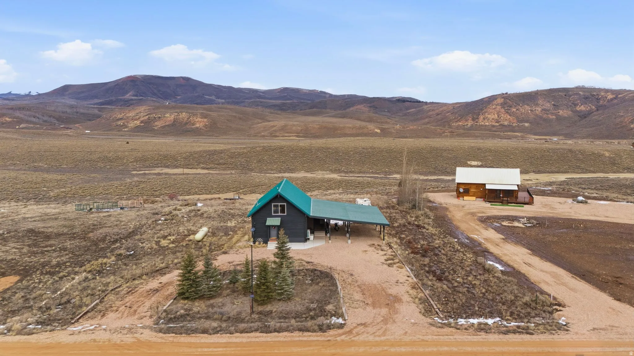Overview of rural landscape with a mountain backdrop