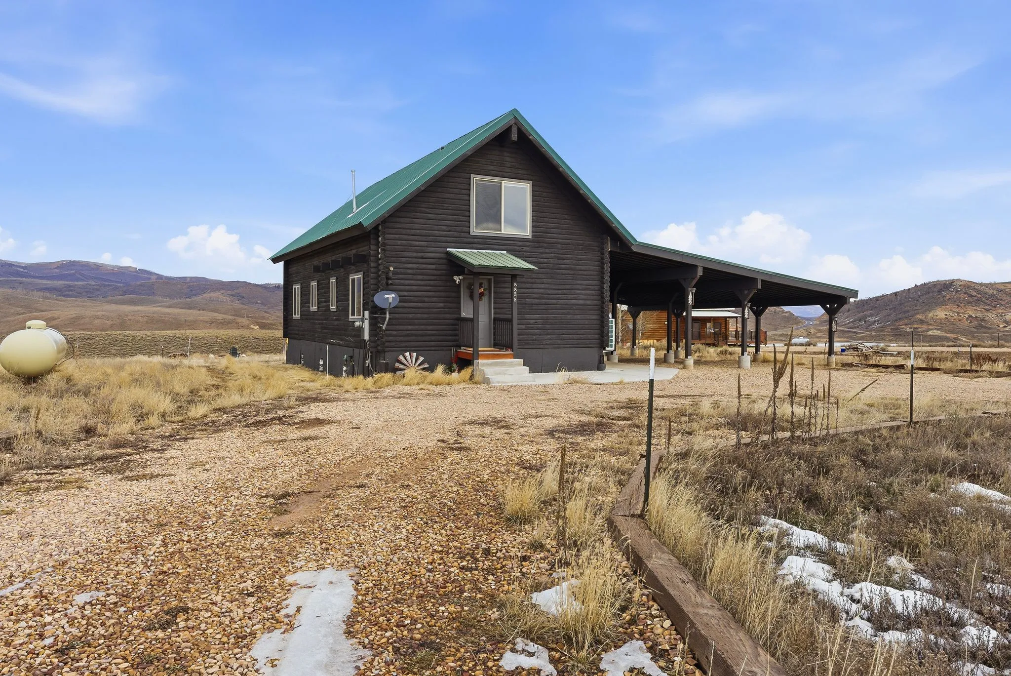 View of front of property featuring a mountain view and a metal roof
