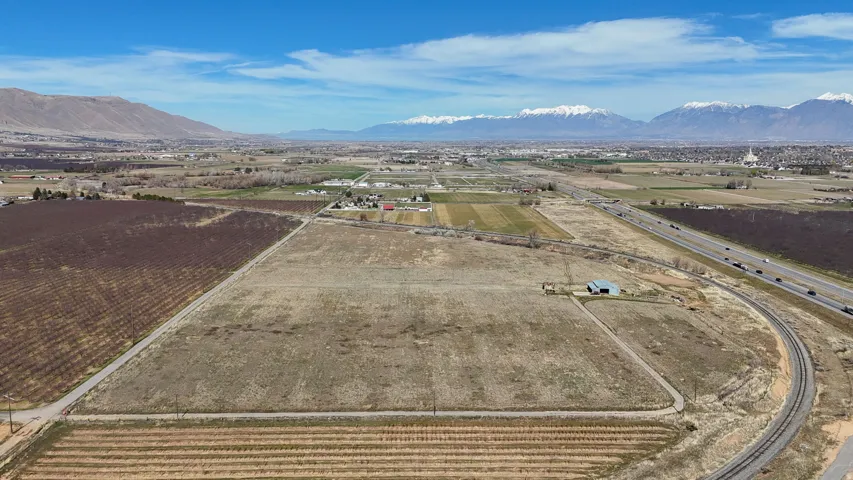 Overview of rural landscape with farmland and a mountainous background