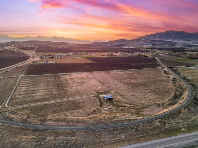 Overview of rural landscape with a mountain backdrop and abundant farmland