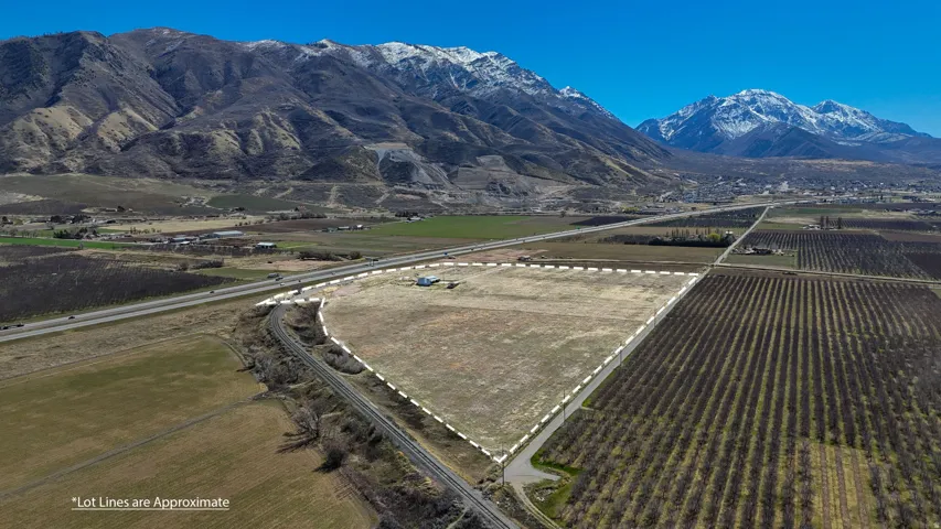 View of mountain backdrop featuring rural landscape and farmland