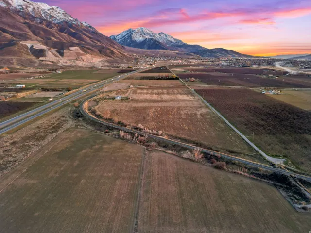 Aerial view at dusk of a view of rural / pastoral area, a mountain view, and agricultural area
