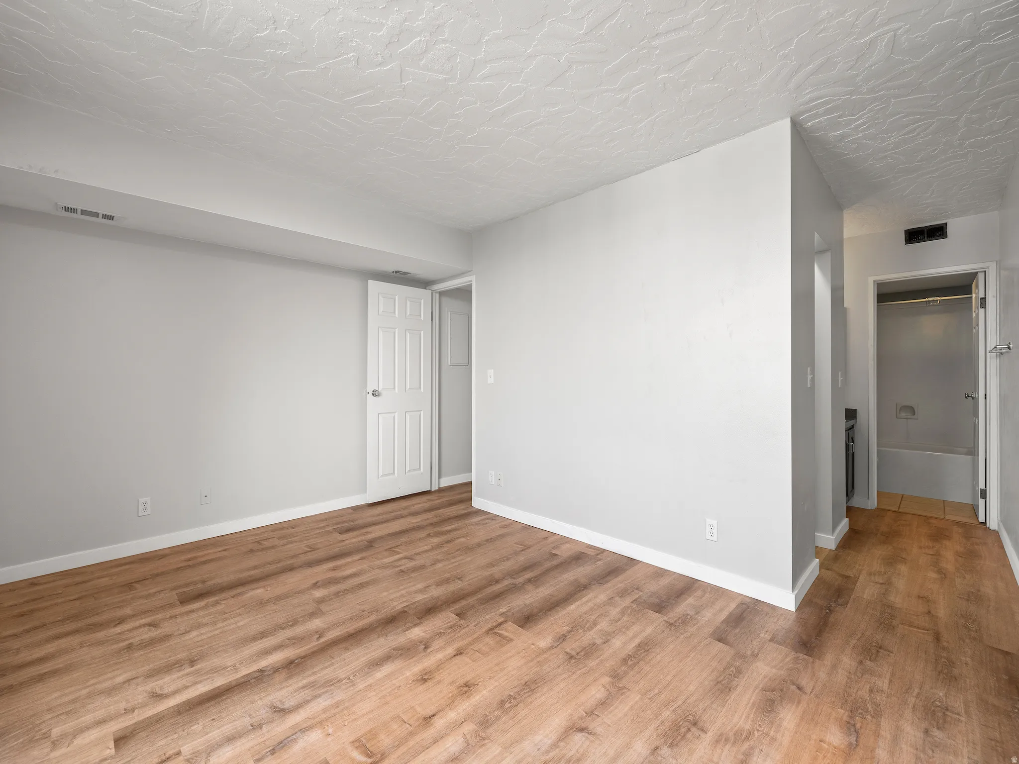 Spare room with light wood-style floors