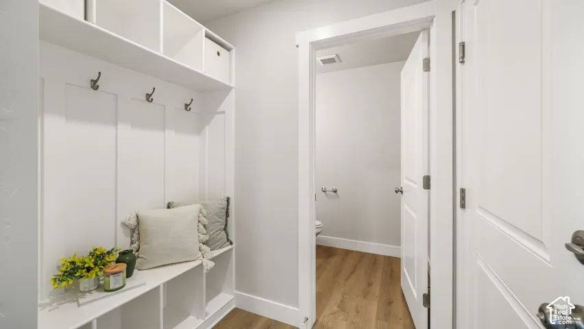 Built-in mudroom bench with storage cubbies and coat hooks