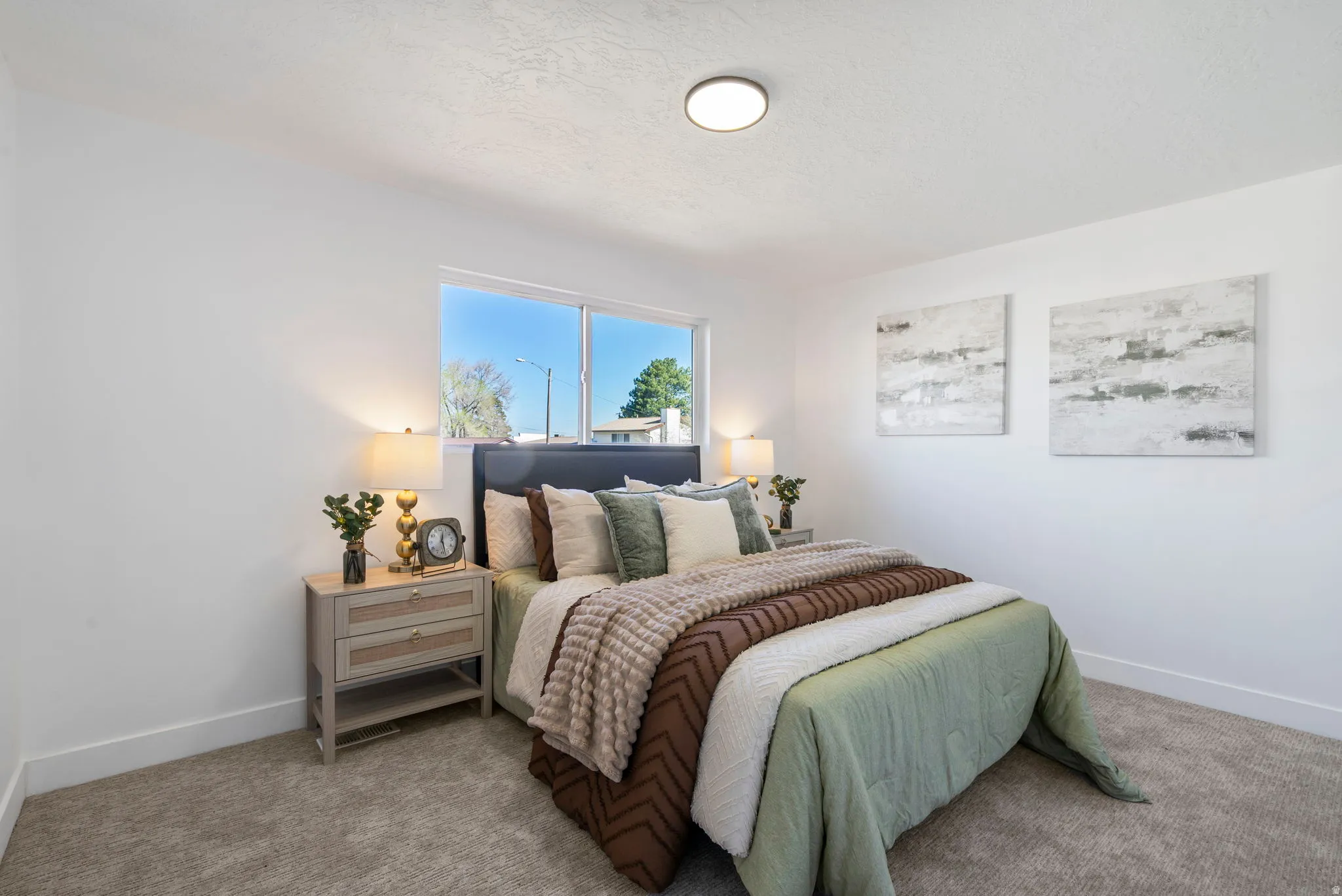 Bedroom with baseboards and carpet