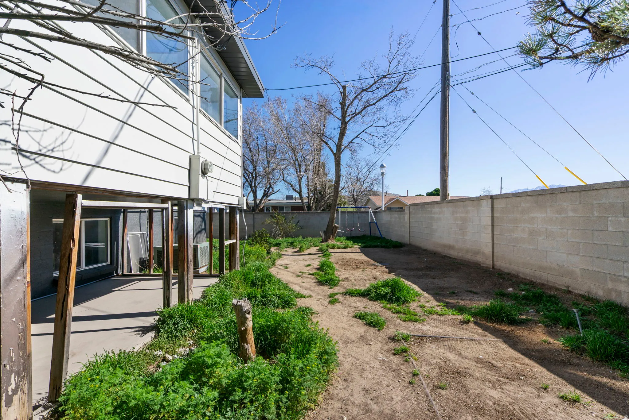 Fenced backyard featuring a patio area