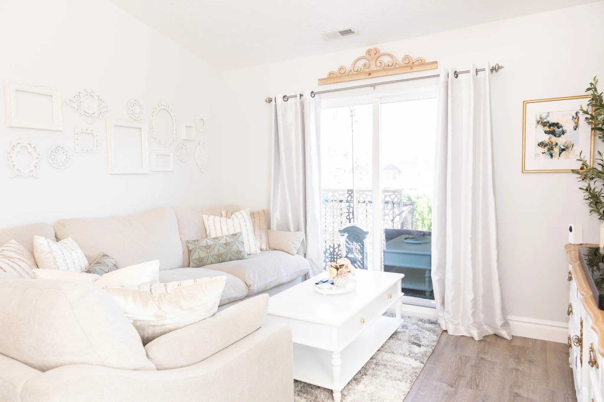 Living area with wood finished floors and baseboards