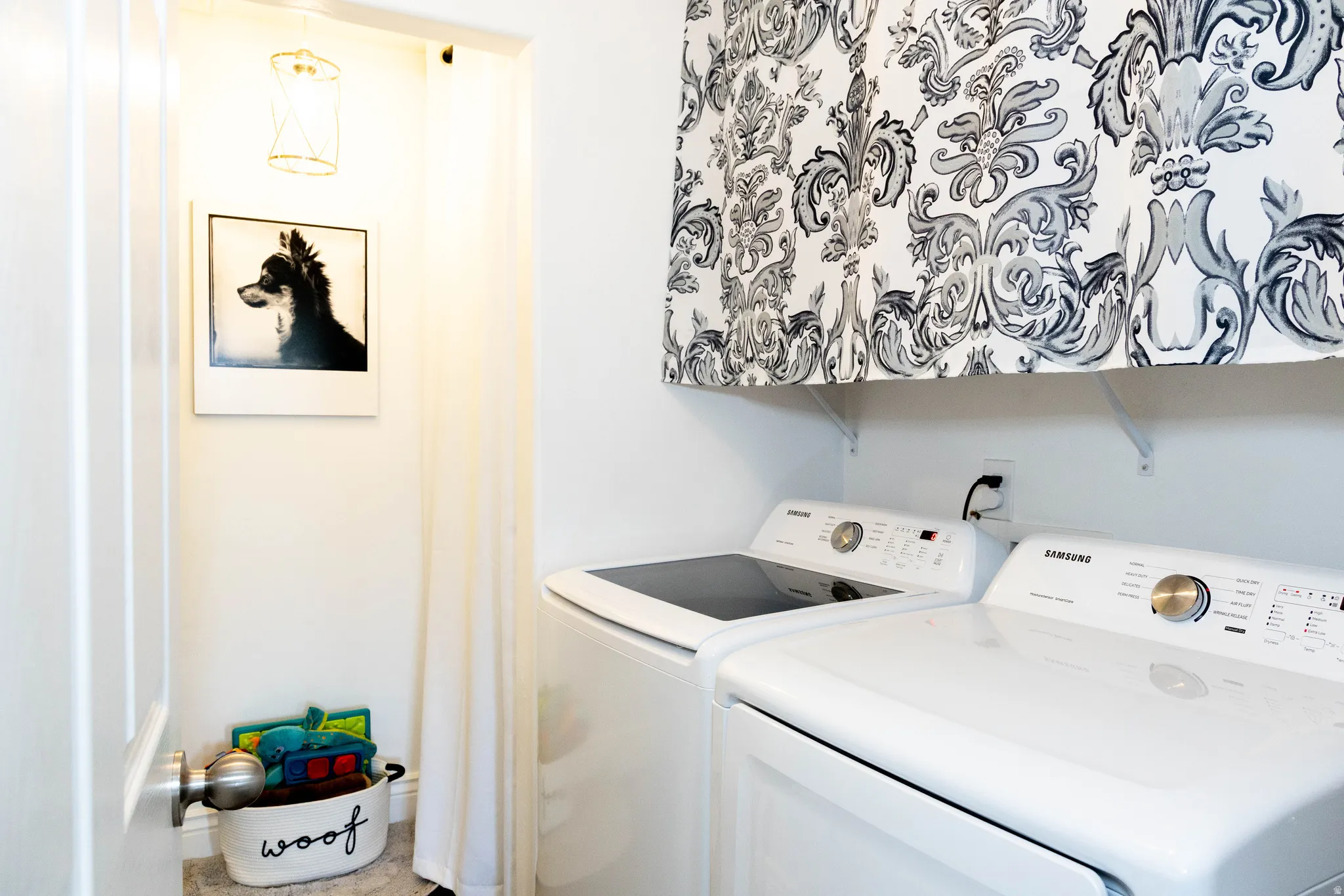 Laundry room featuring washer and clothes dryer