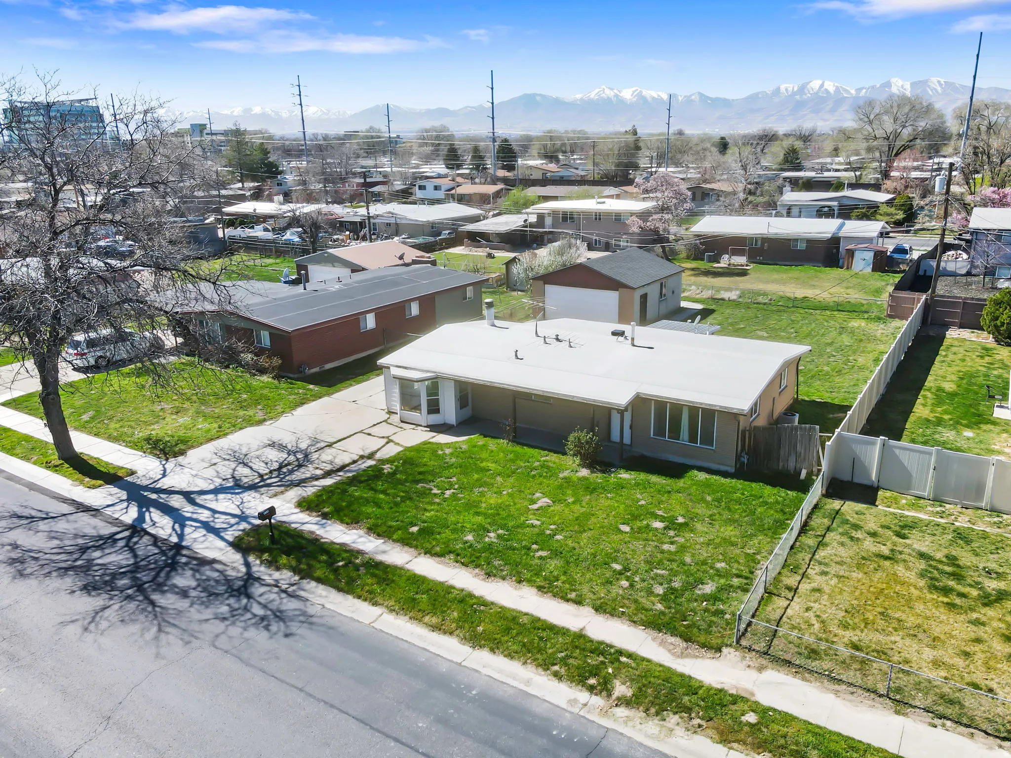 Aerial view of residential area featuring a mountain backdrop