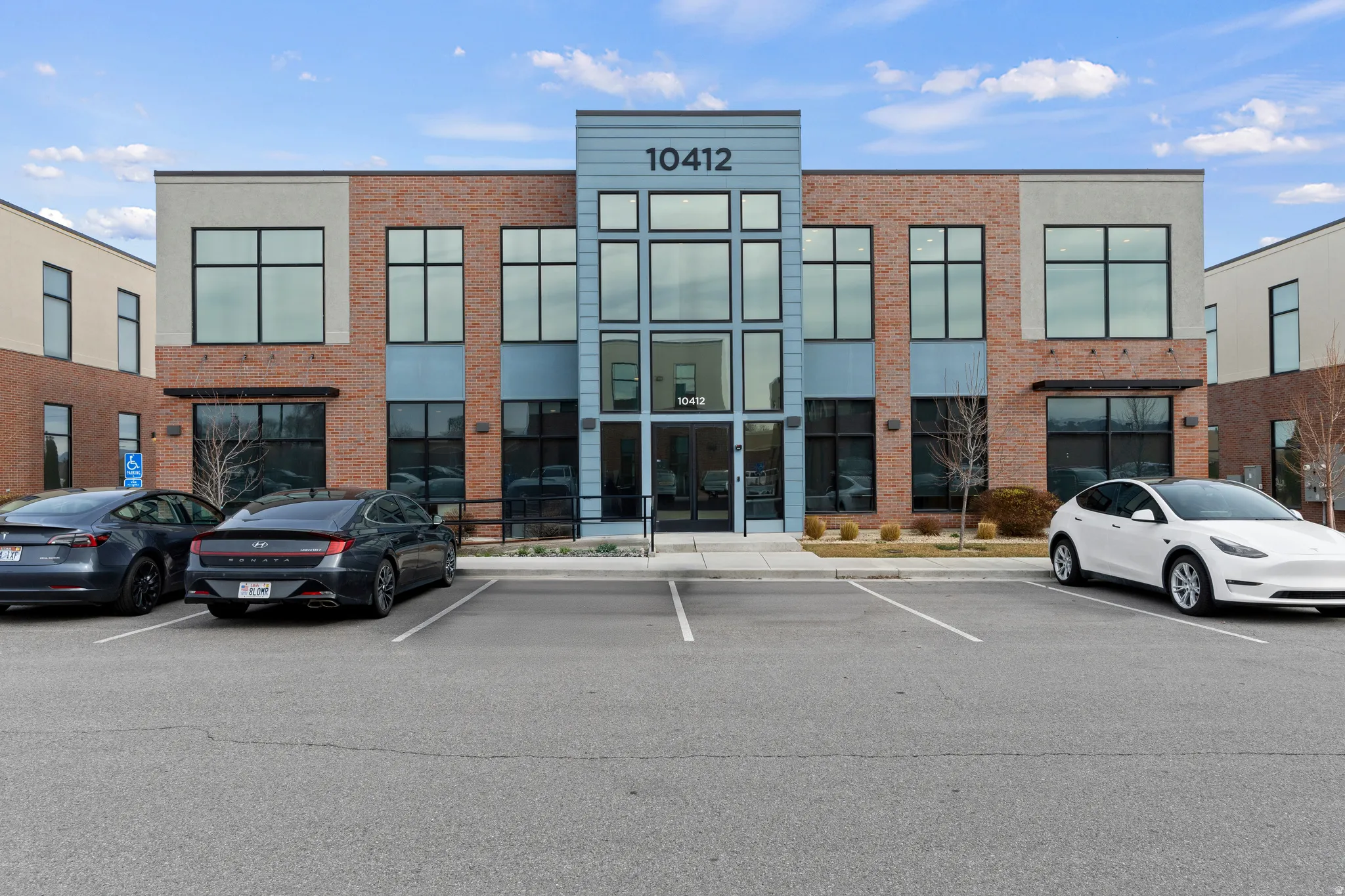 View of property with uncovered parking