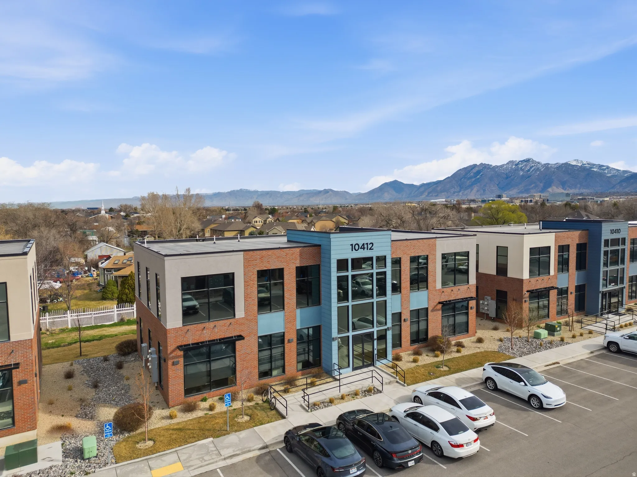 View of property featuring uncovered parking and a mountain view