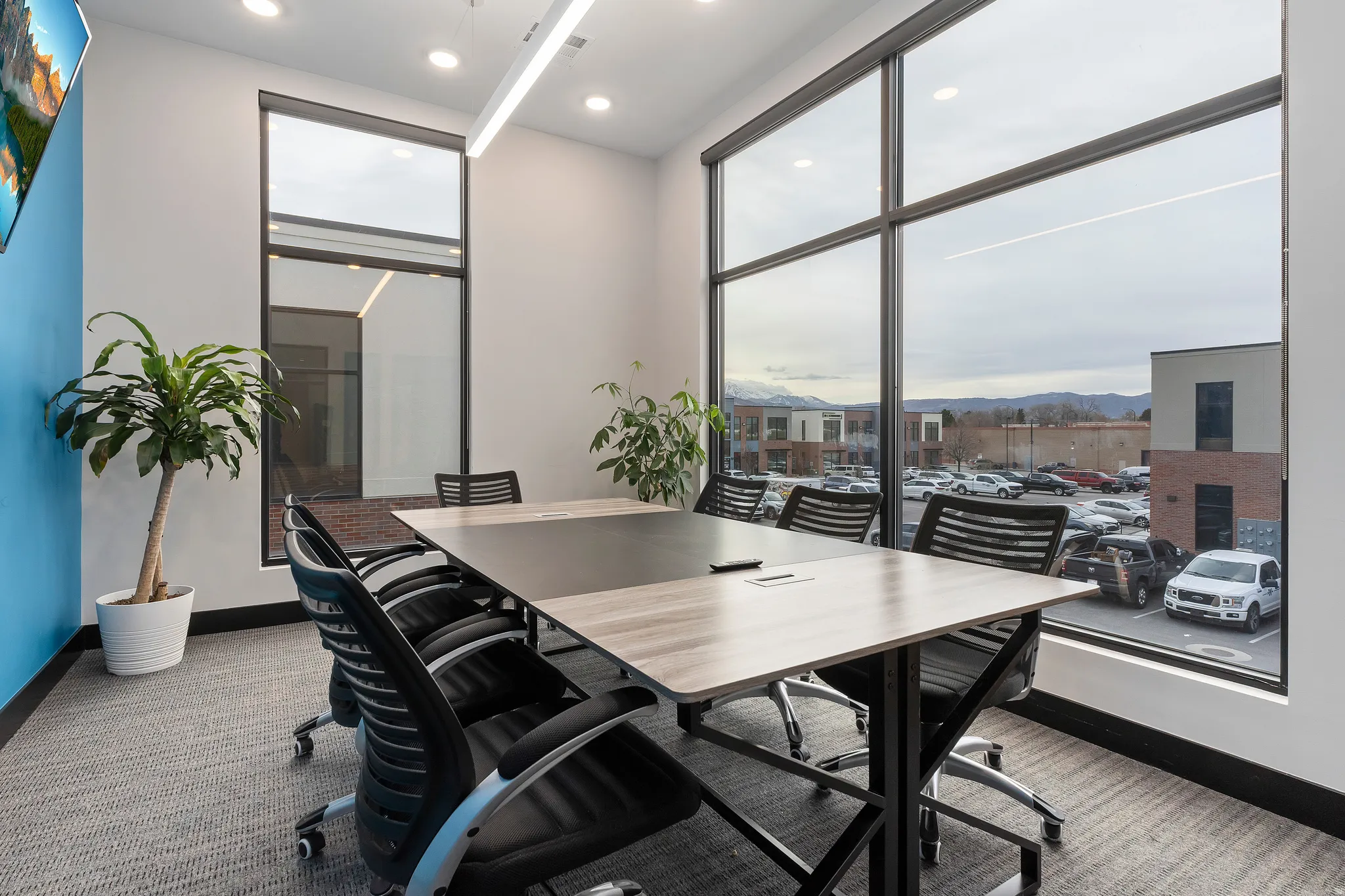 Home office featuring a mountain view, recessed lighting, carpet floors, and plenty of natural light