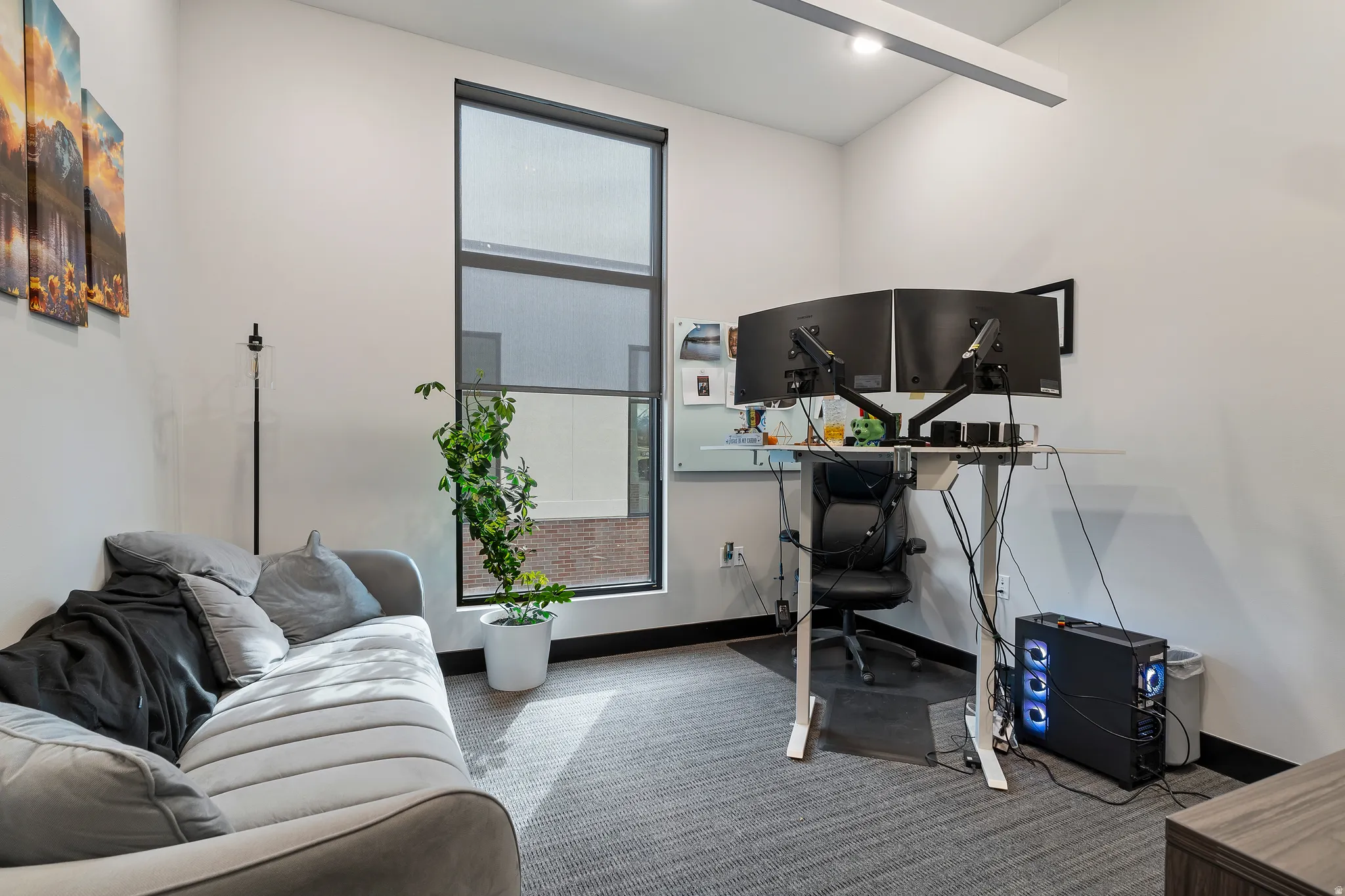 Carpeted home office with baseboards