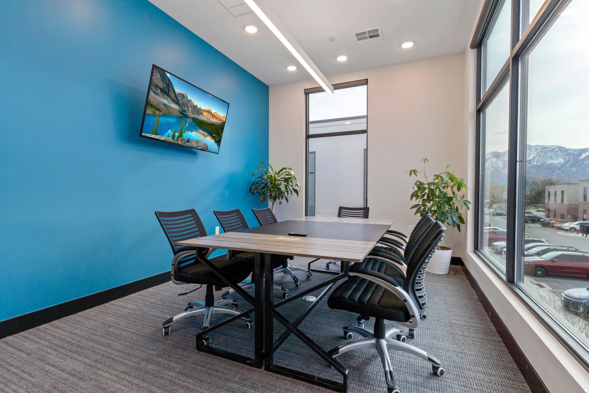 Office featuring dark carpet, healthy amount of natural light, and recessed lighting