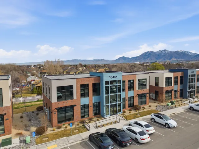 View of property featuring uncovered parking and a mountain view