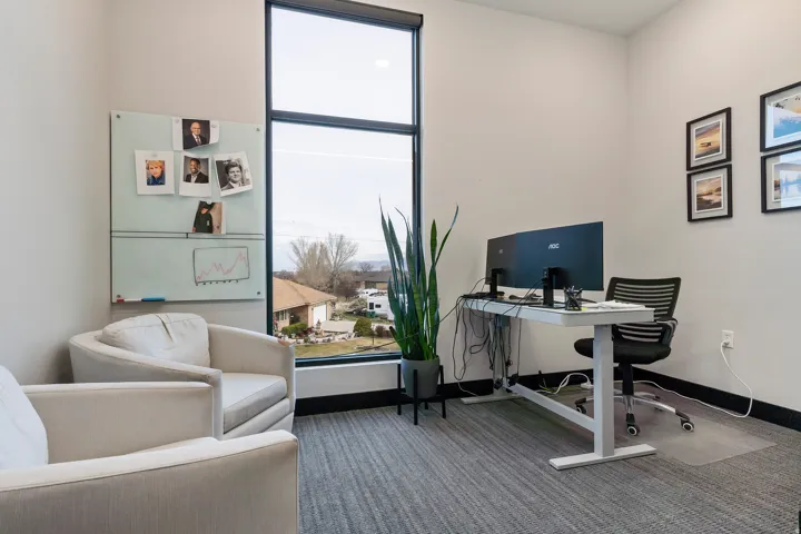 Home office with baseboards and carpet floors