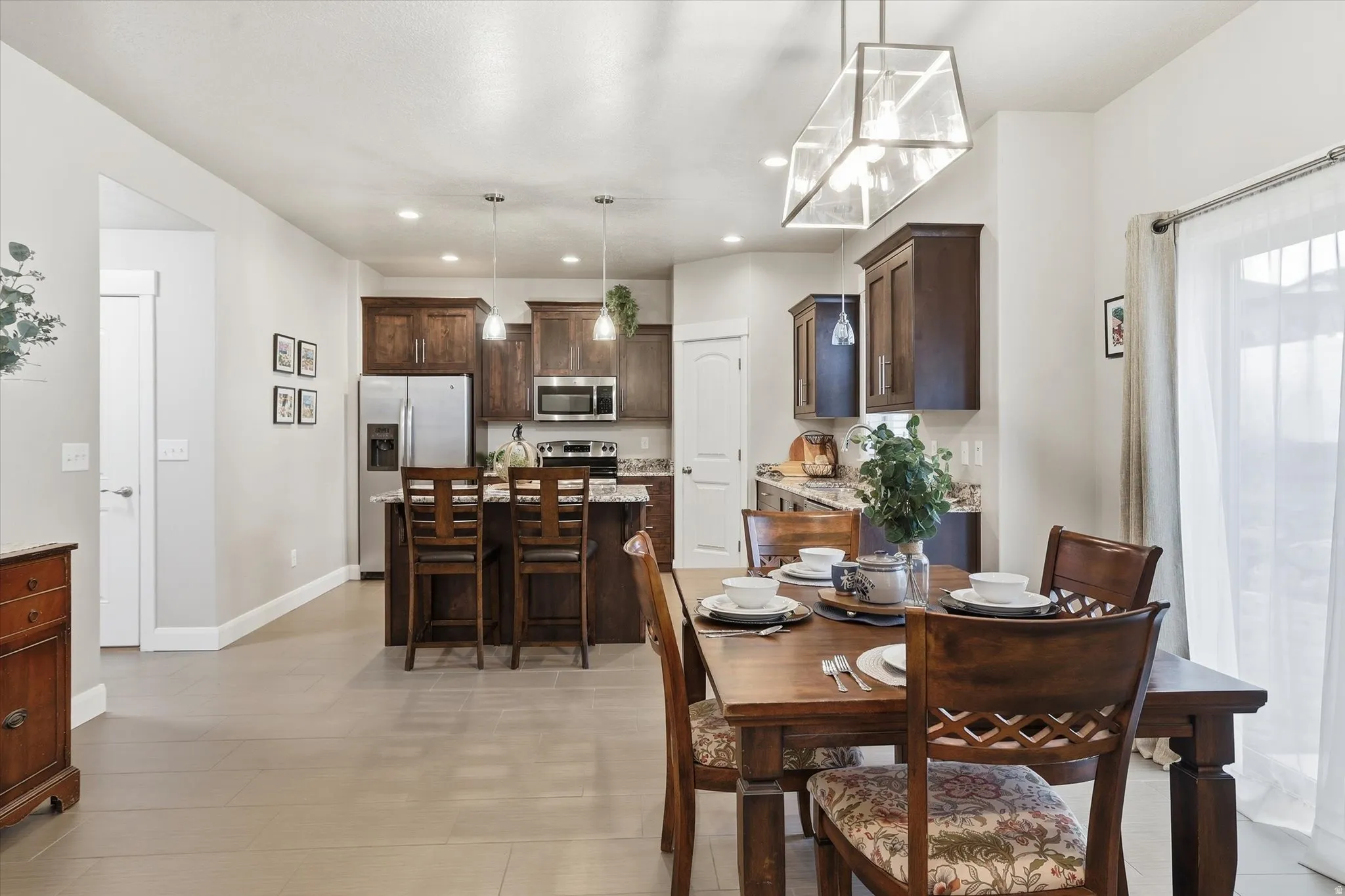 Dining area featuring baseboards and recessed lighting