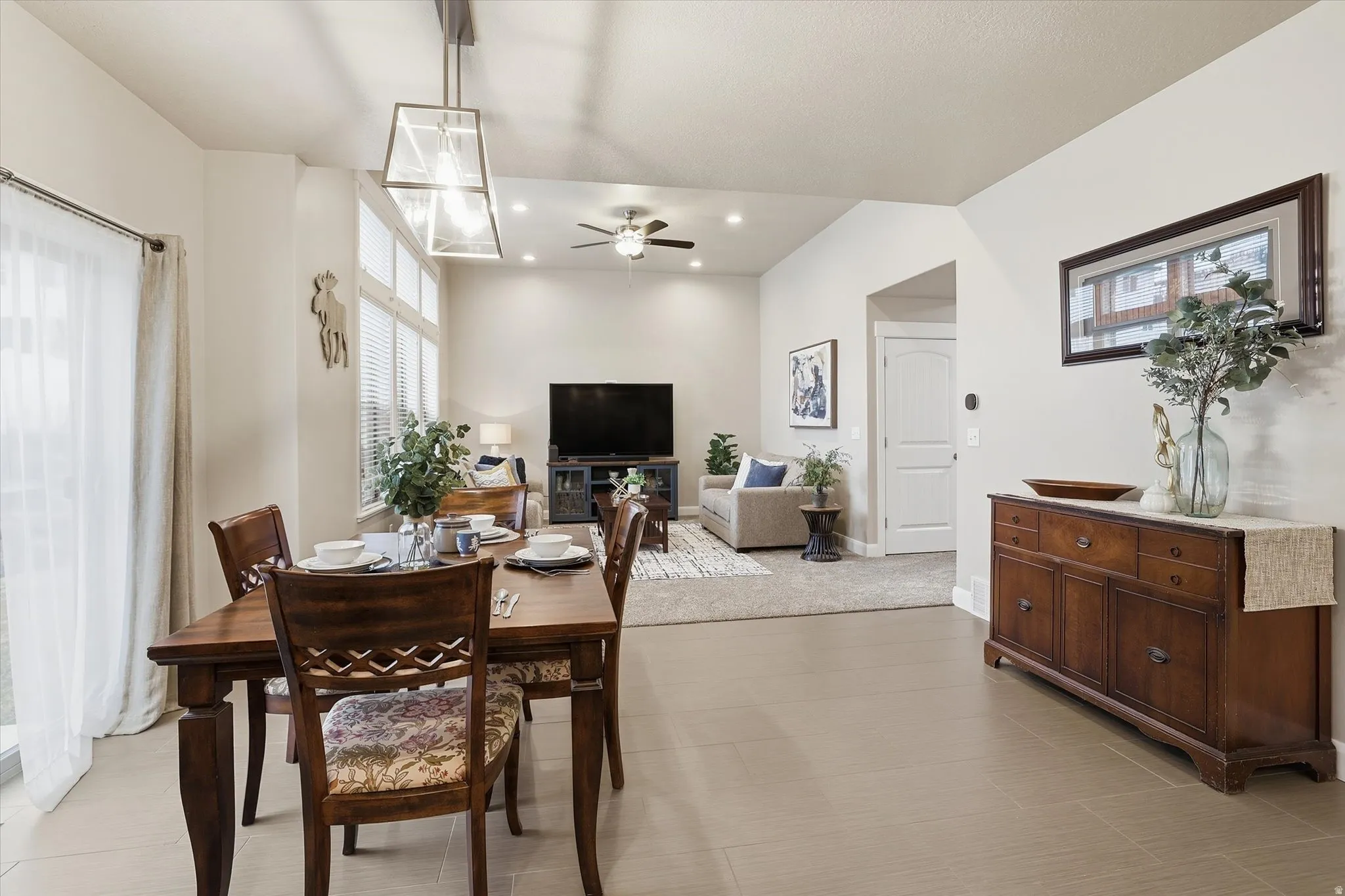 Dining area featuring ceiling fan and recessed lighting
