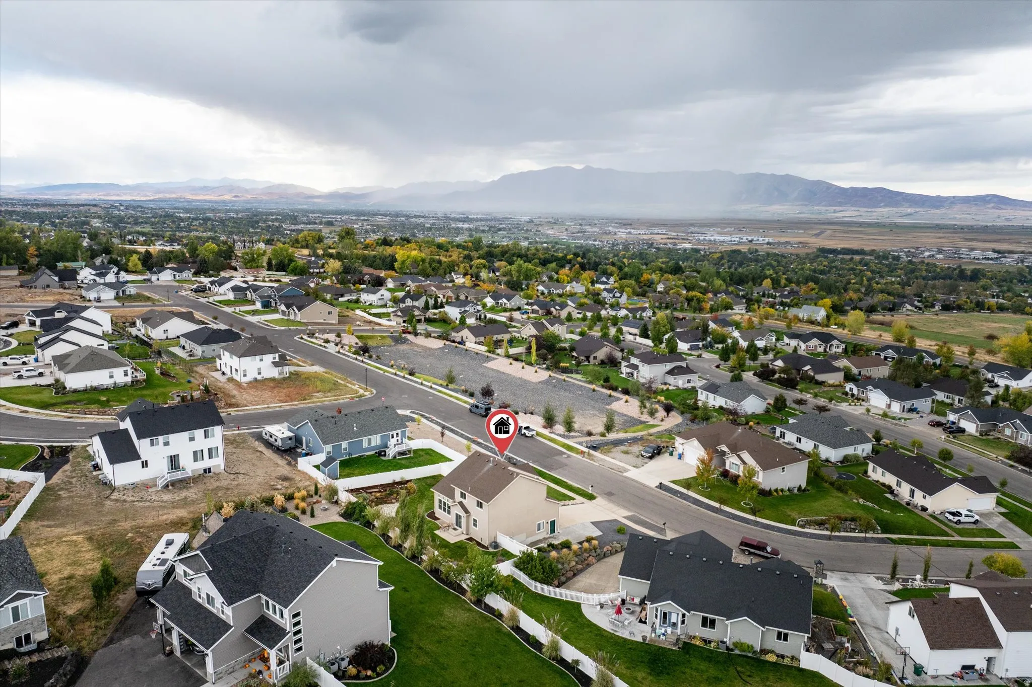 Aerial view of residential area featuring a mountainous background