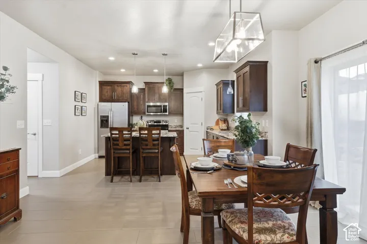 Dining area featuring baseboards and recessed lighting