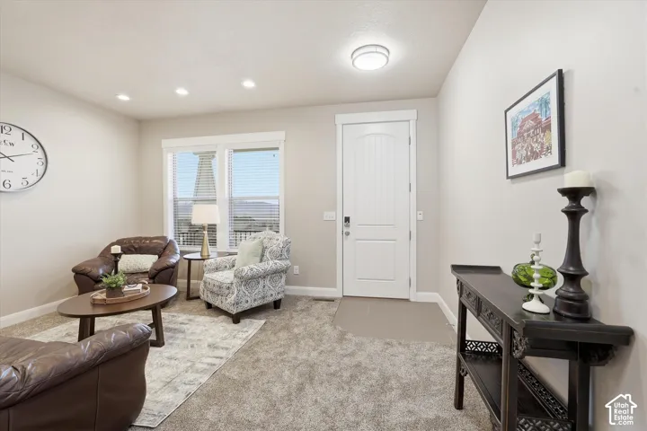 Sitting room featuring light carpet and recessed lighting