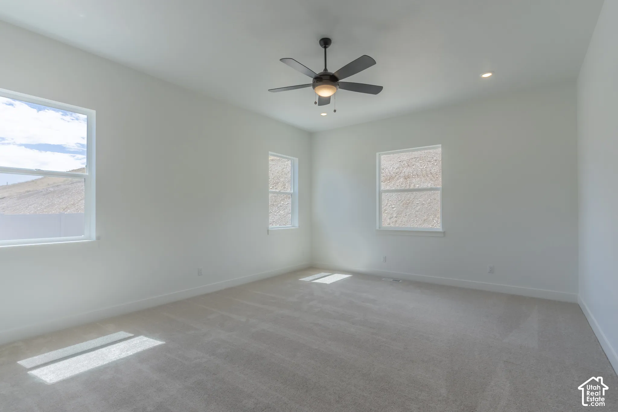 Recessed lighting, ceiling fan, and multiple windows