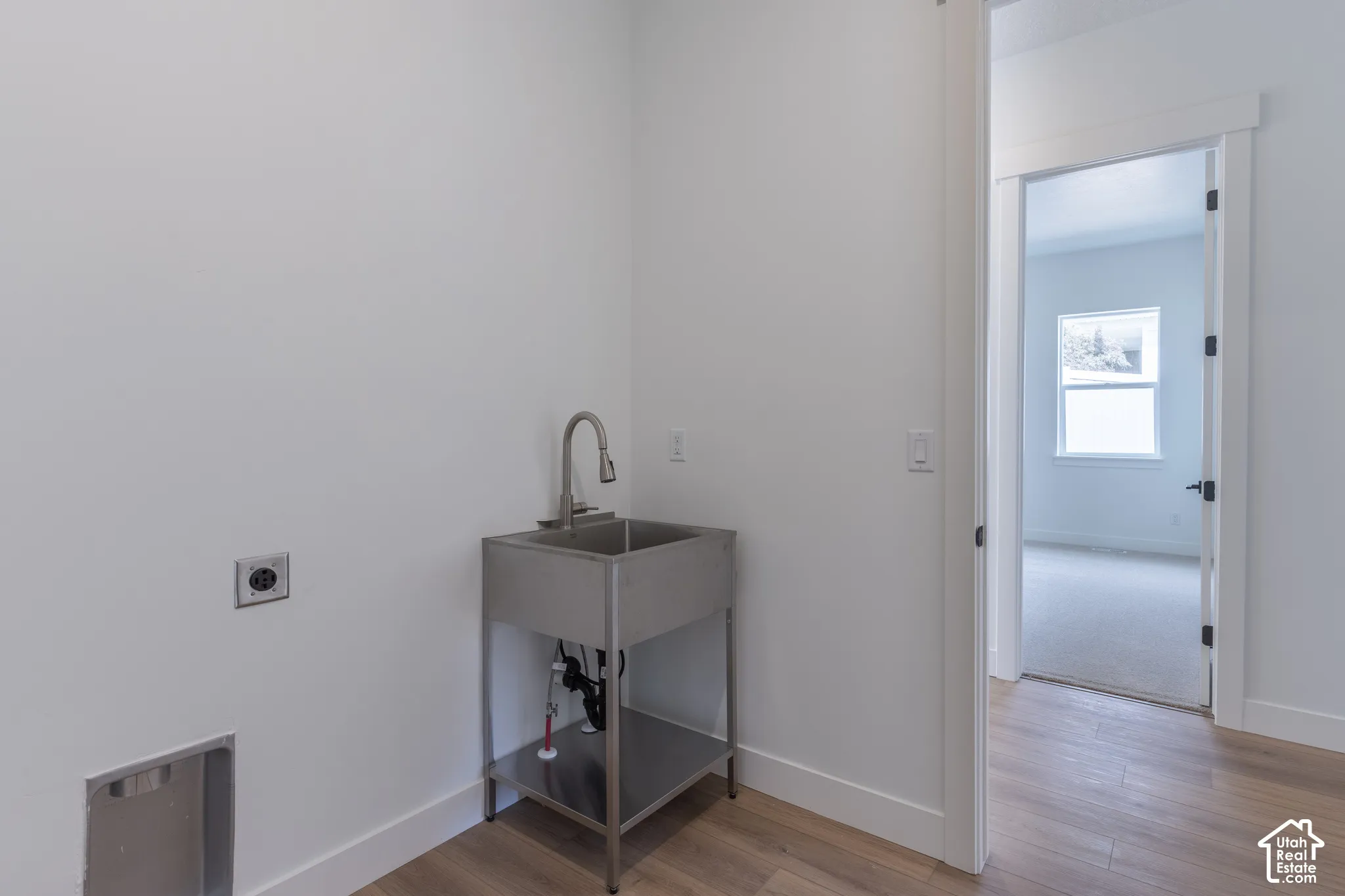 Utility sink with a gooseneck faucet