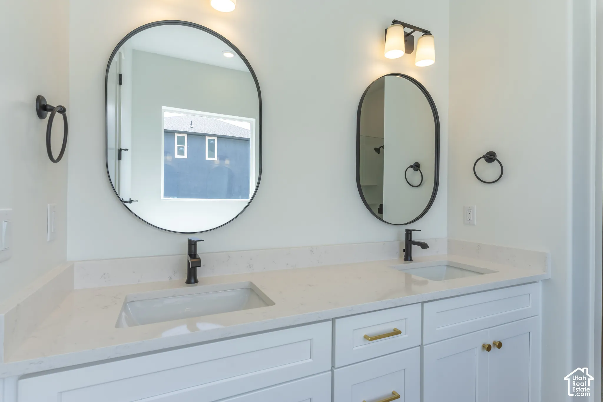 Dual oval mirrors with matte black frames