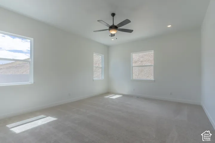 Recessed lighting, ceiling fan, and multiple windows