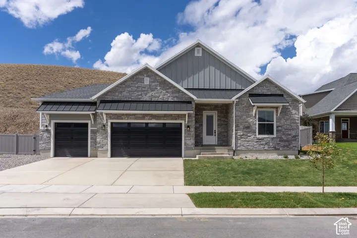 Stone and siding exterior with a multi-gabled roofline