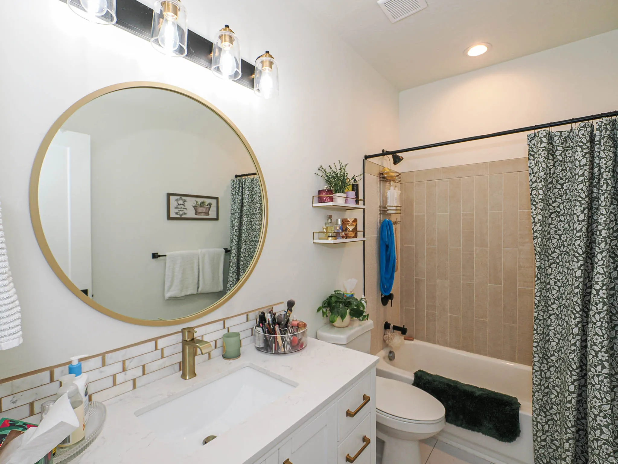Bathroom with vanity, shower / bath combo with shower curtain, and recessed lighting