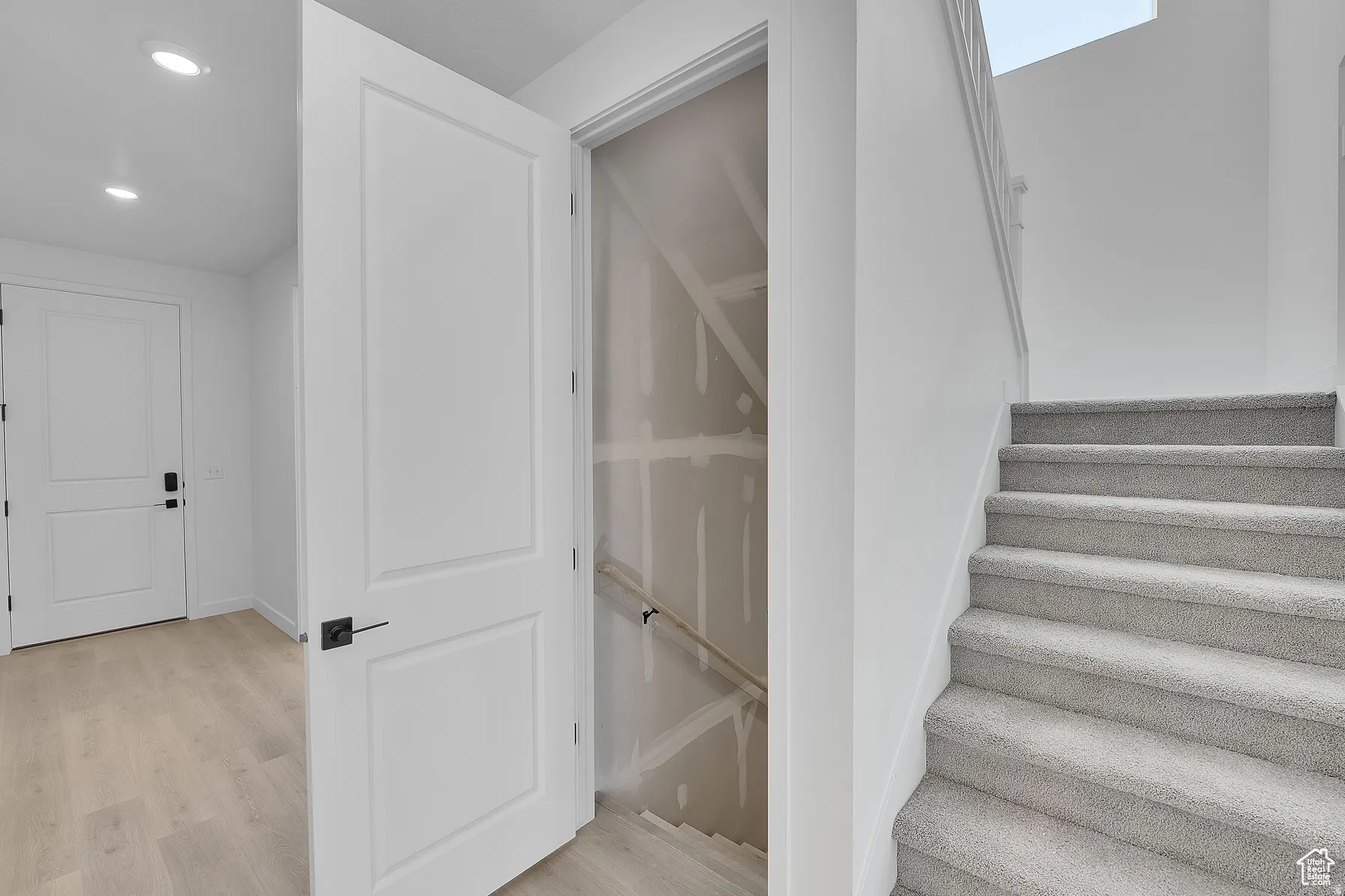 *Colors may vary** Stairs with wood finished floors and recessed lighting