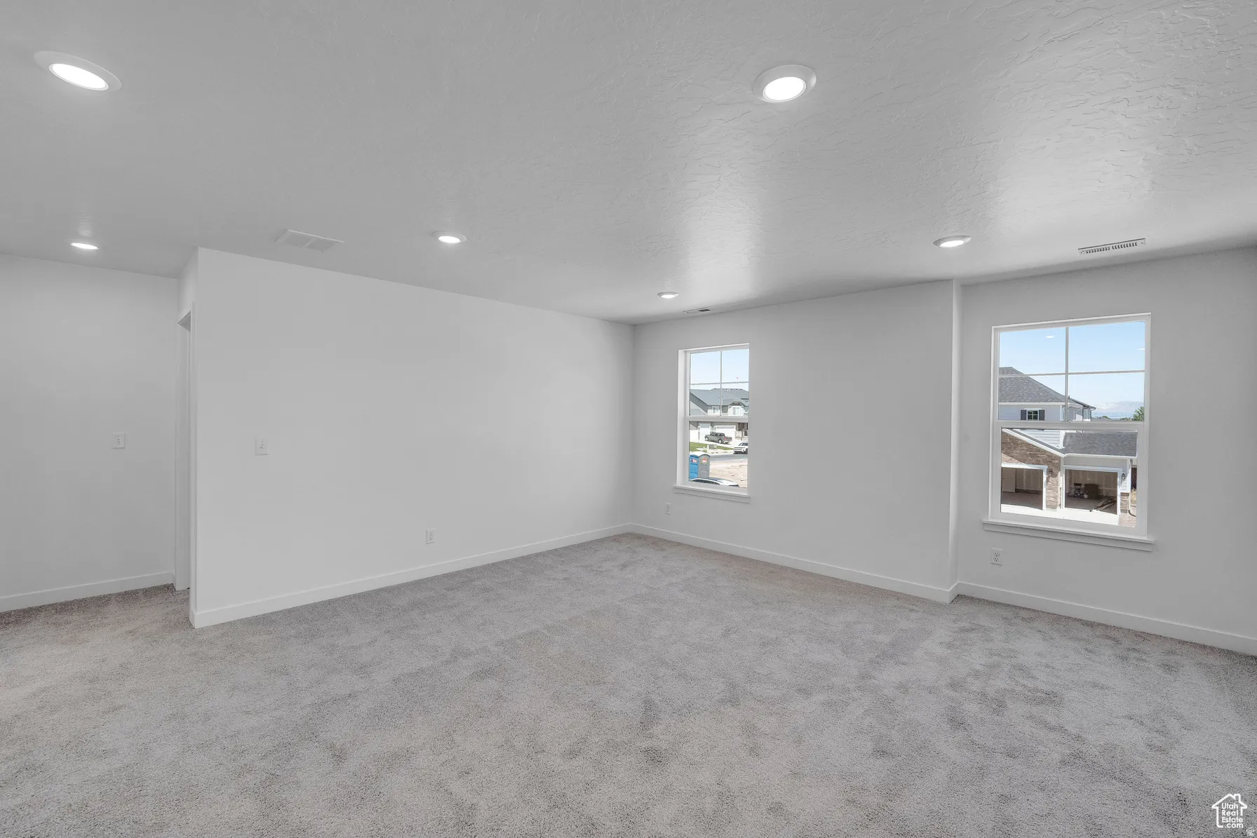*Colors may vary**large loft featuring light colored carpet, recessed lighting, and a textured ceiling