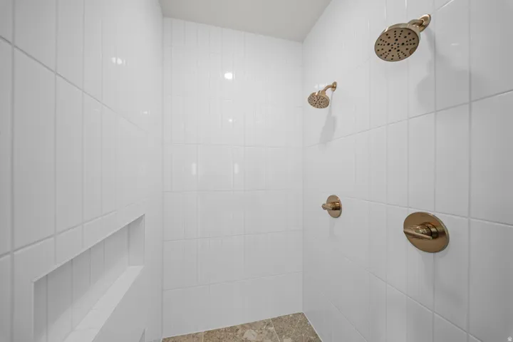 Full bathroom with tiled shower