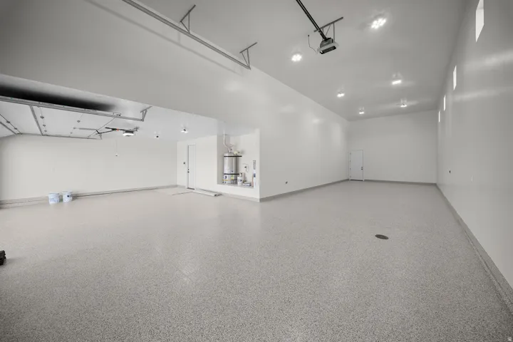 Garage with strapped water heater
