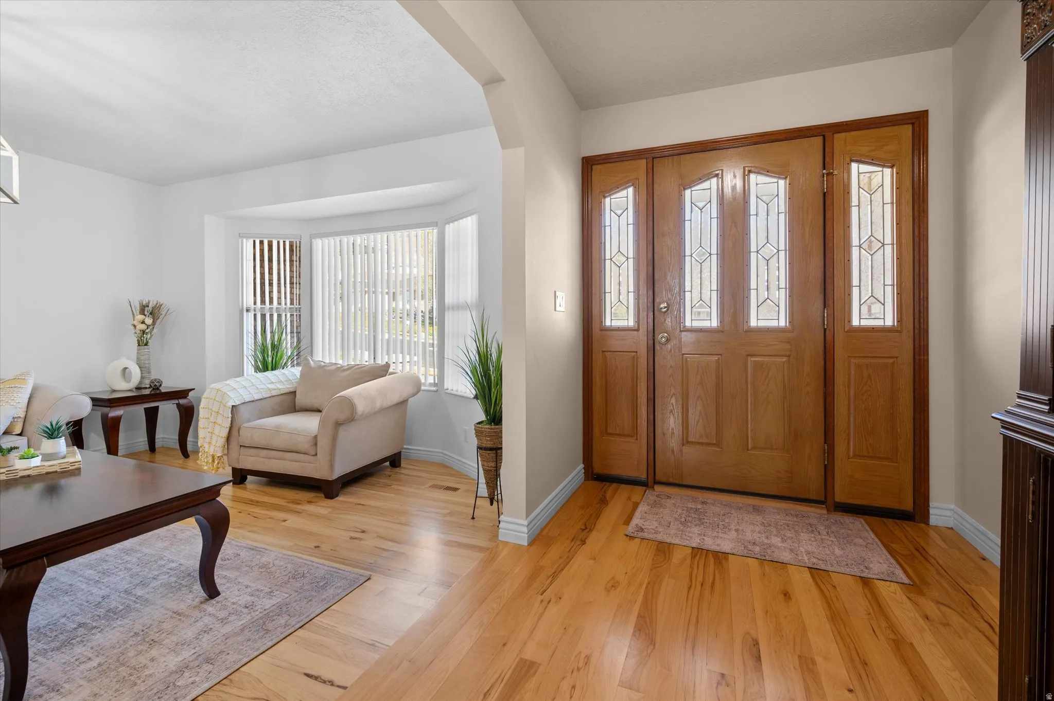 Entryway featuring hickory flooring
