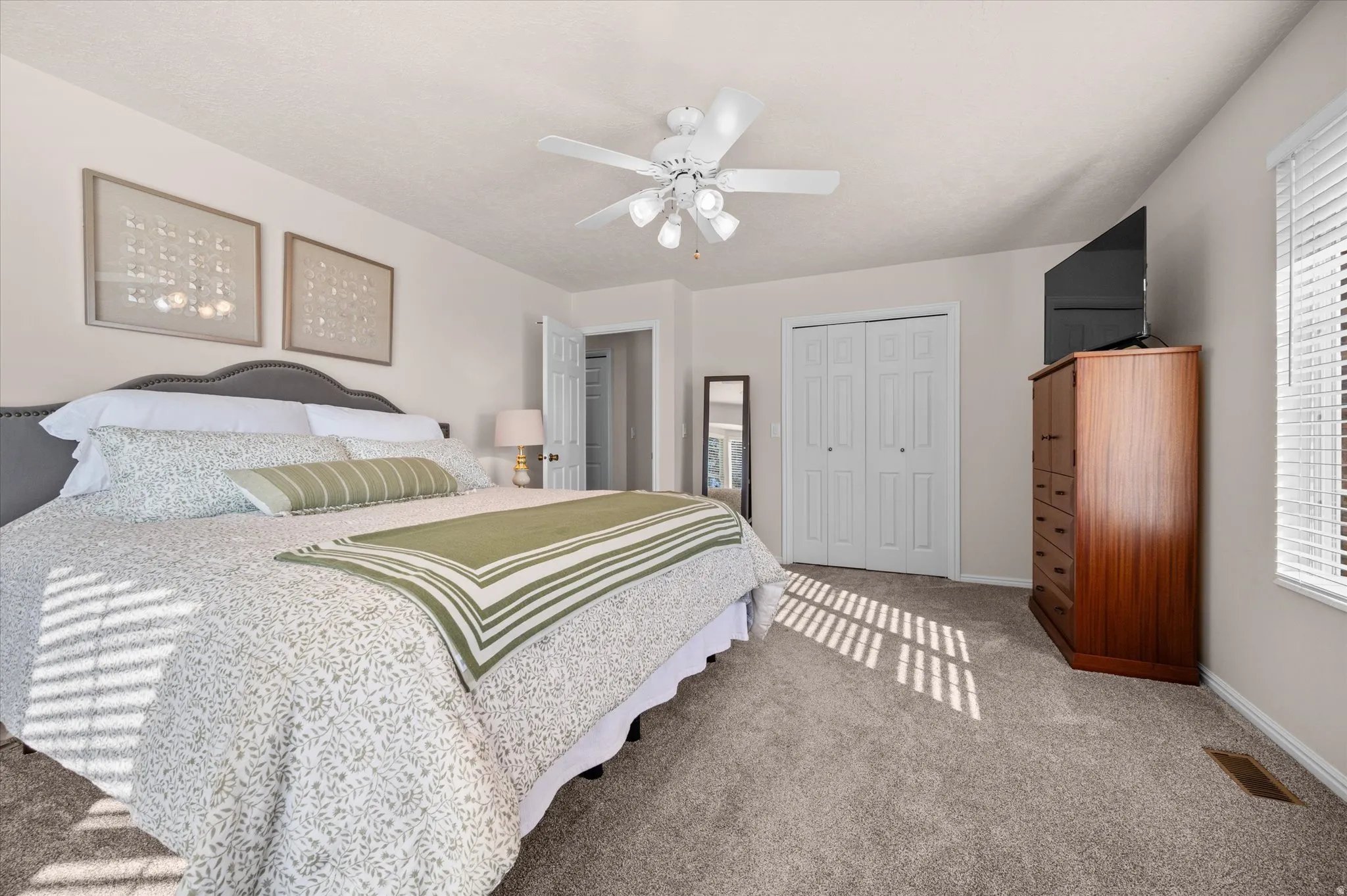 Primary bedroom with walk in closet