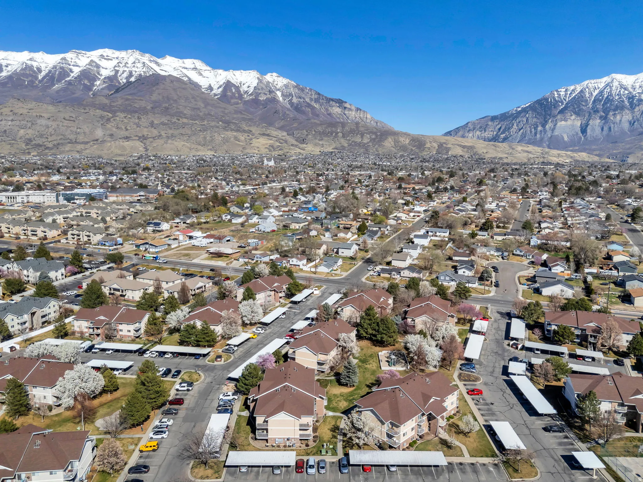 Aerial perspective of suburban area with a mountain backdrop