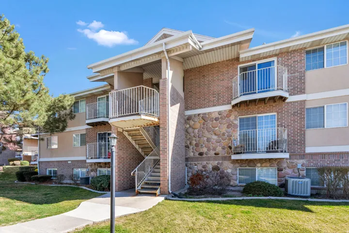 View of apartment building / complex with stairs