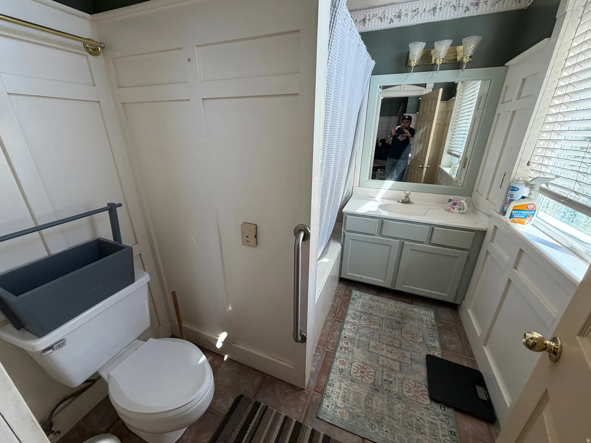 Bathroom with vanity and shower / tub combo